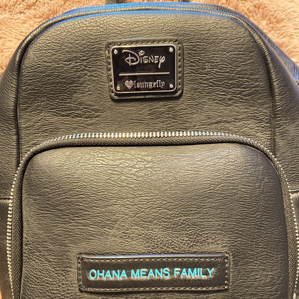 Practically new, leather purse/backpack Disney with stitch them + change purse